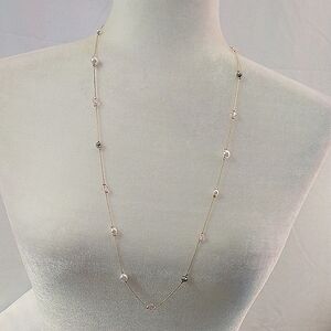 Simple, but pretty, gold tone necklace with faux pearls and beads. NWT
